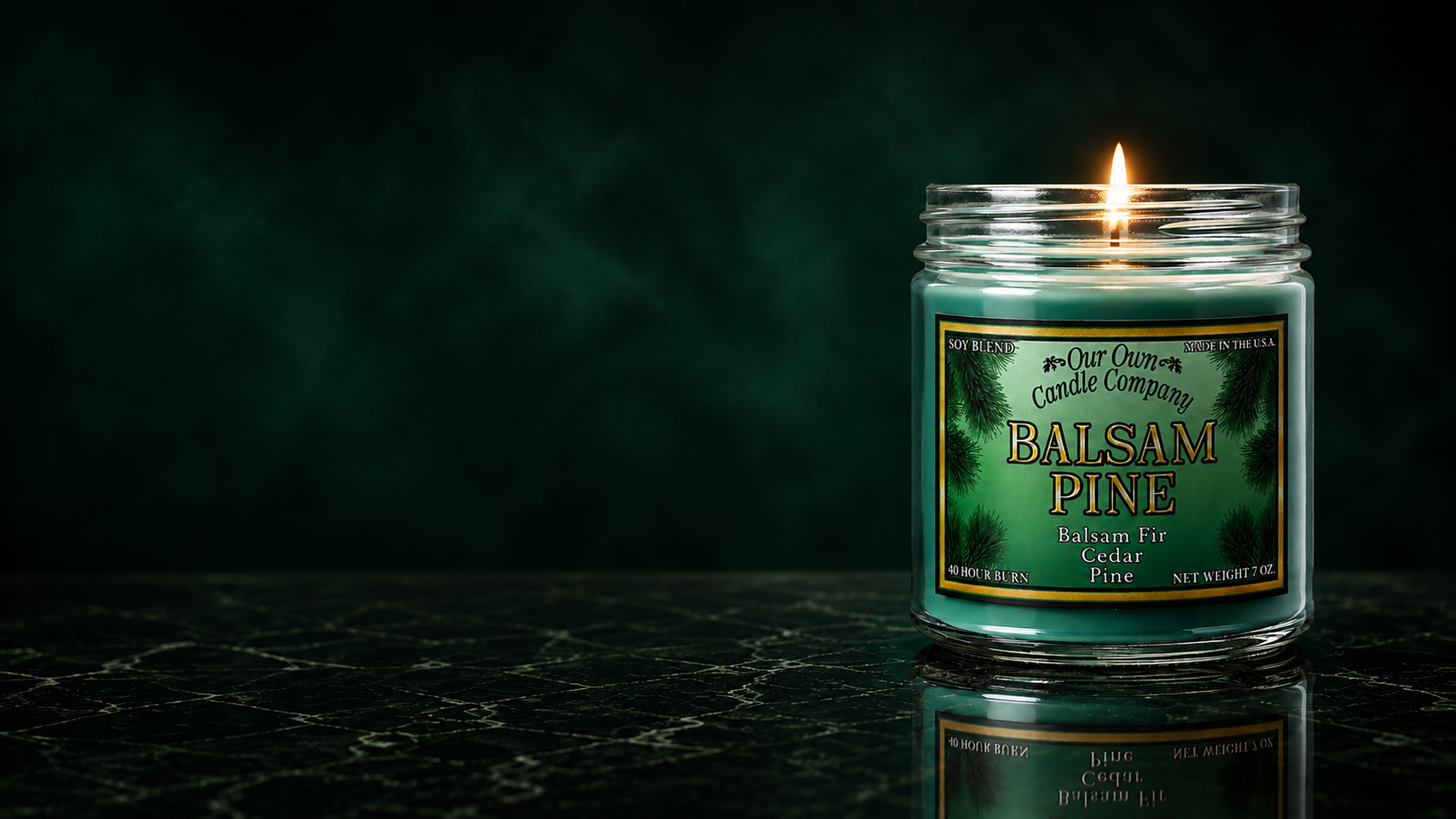 Lit Balsam Pine Gold Series candle